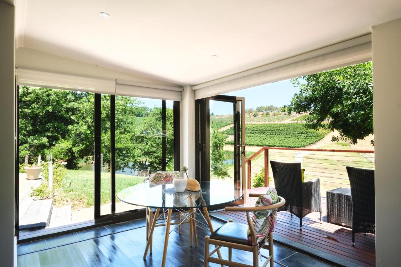 Alluvia Boutique Winery & Luxury Accommodation Stellenbosch Eksteriør bilde A room with a view of the vineyards